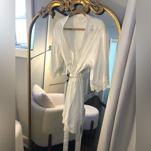 White robe used for wedding photos. Worn once